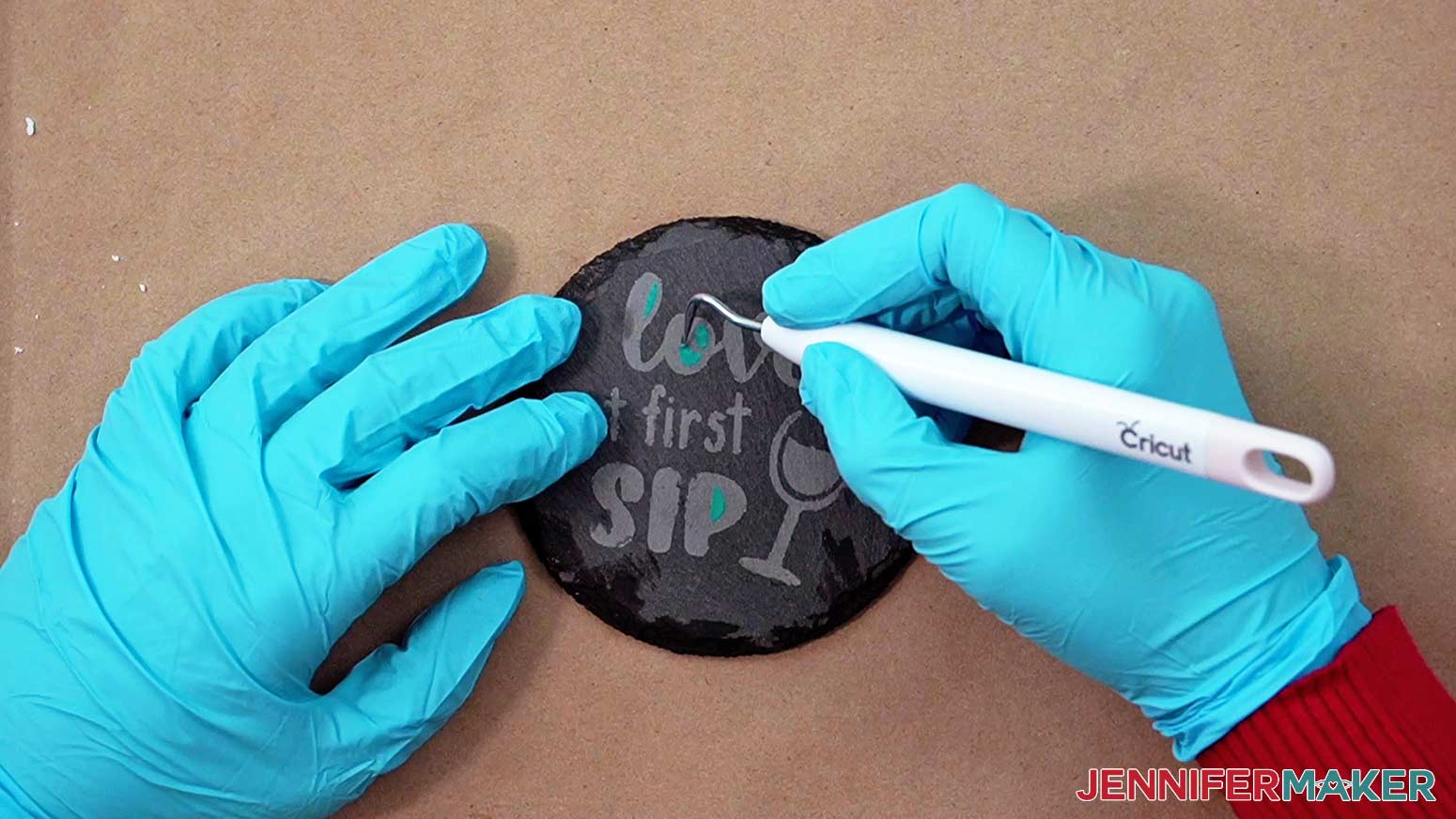 Remove any remaining pieces of vinyl from your etched slate coaster with a weeding tool.