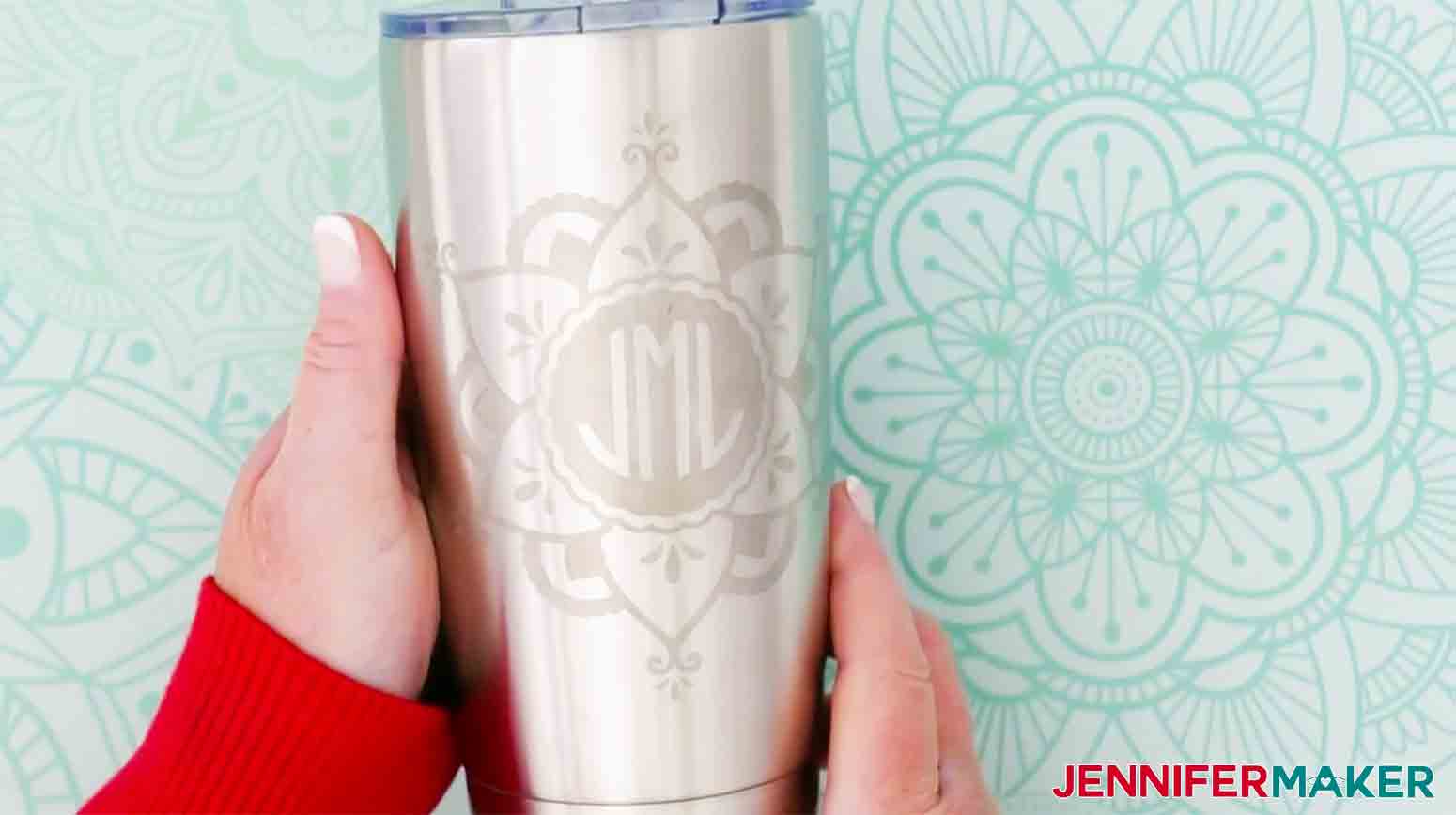etched stainless steel tumbler with monogram design including initials JML inside a mandala