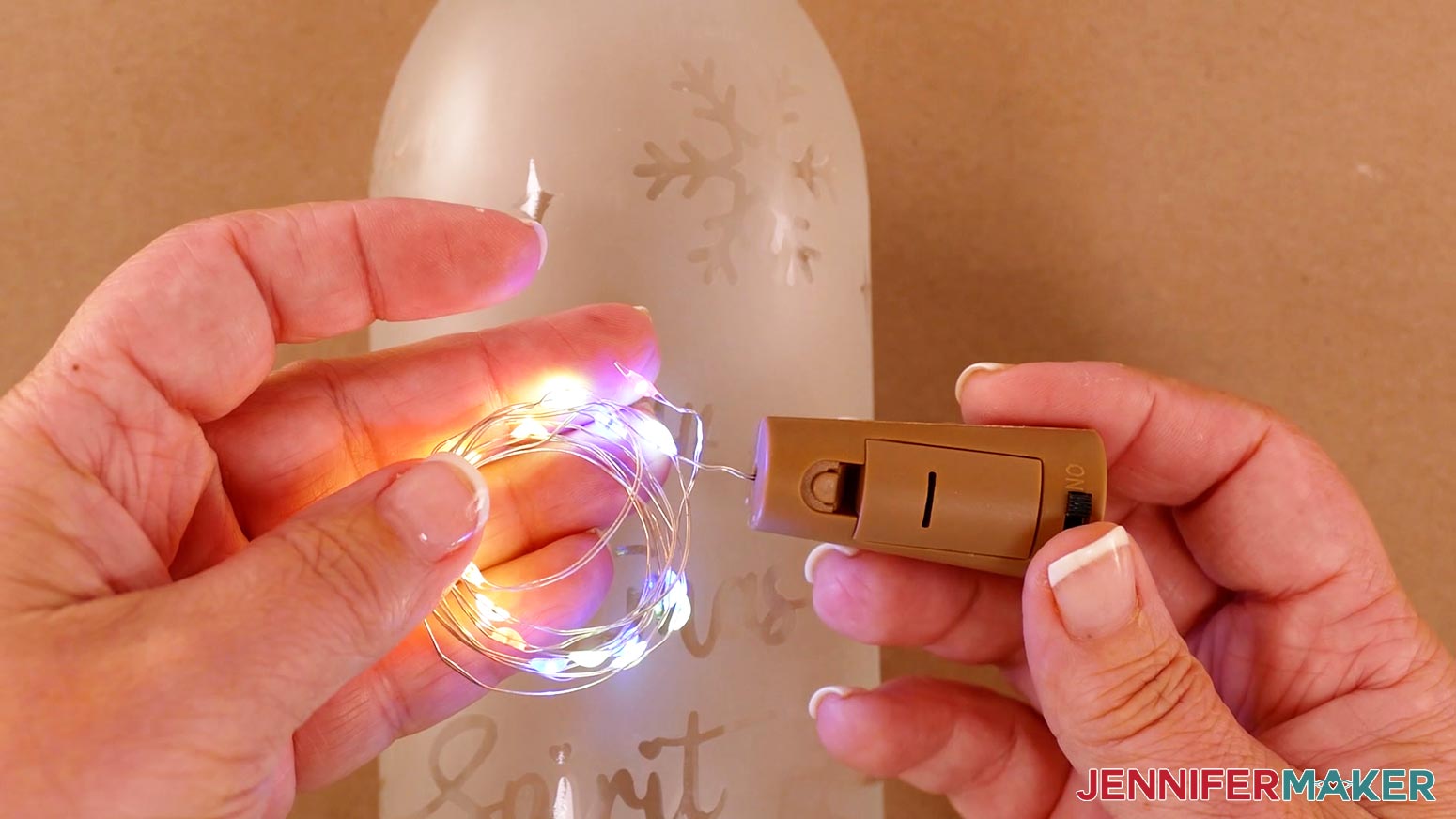 Turn on your wine bottle fairy lights to make sure they work using the switch on the cork-shaped topper. Remove the battery protector tab if there is one.
