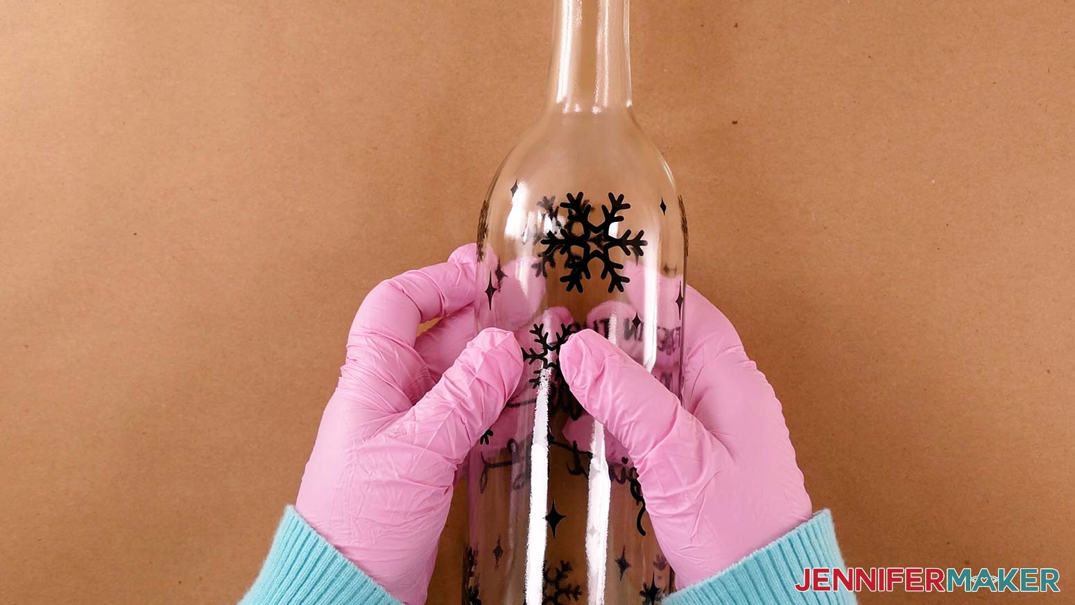 Press the vinyl stencil onto your wine bottle really well with your fingers before applying etching cream to prevent the cream from seeping underneath