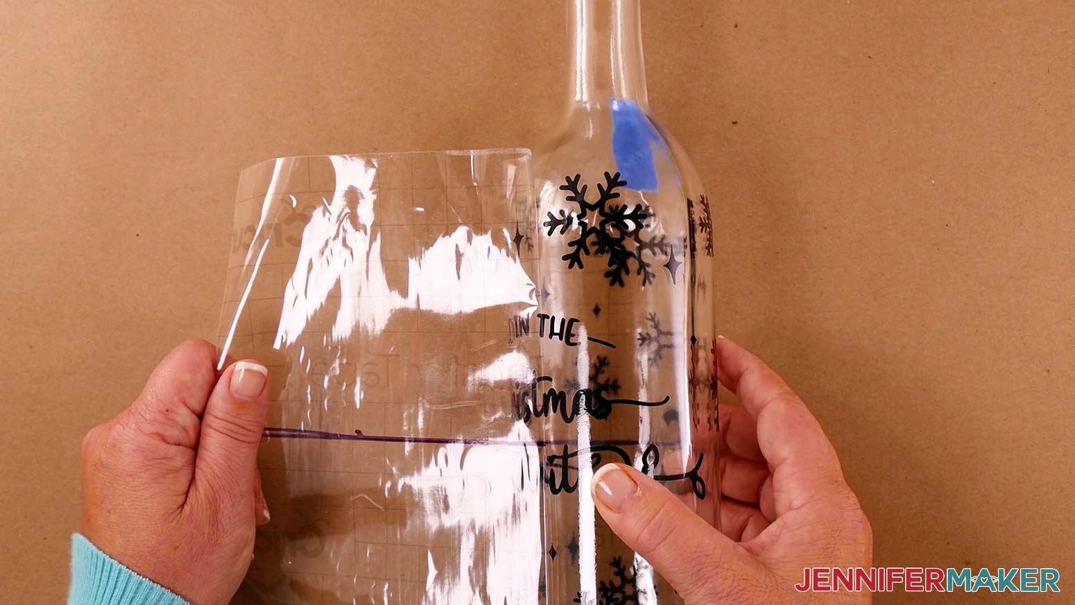 Carefully remove the transfer tape from your etched wine glasses and bottles design after it's adhered to the bottle