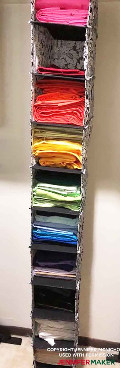 Store fabric in a clothes organizer for a great fabric organization idea!