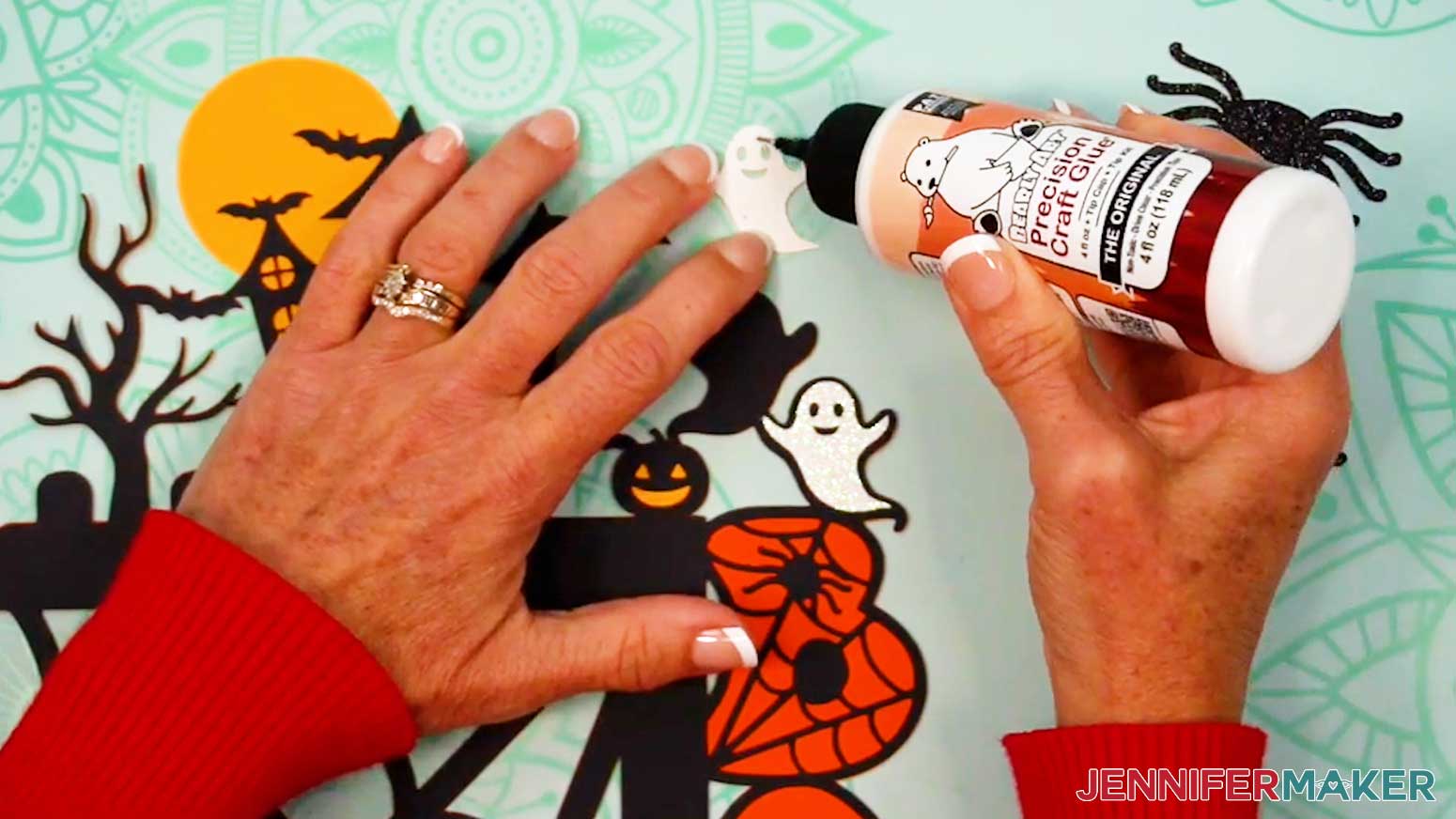 Apply craft glue to the back side of the left ghost.