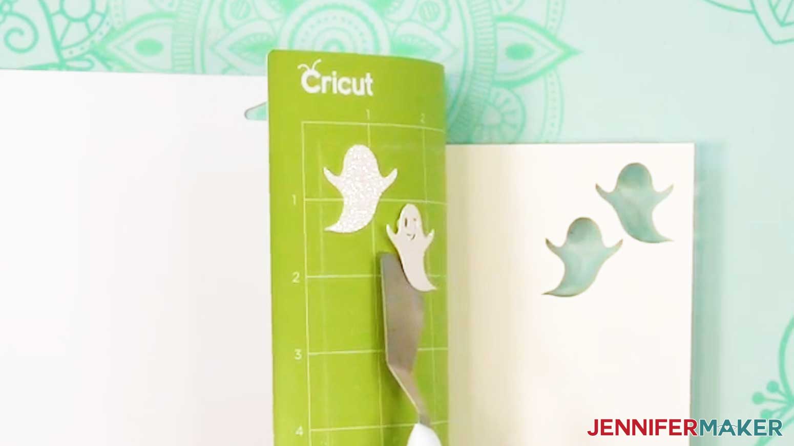 Use a scraper tool to remove delicate pieces of cardstock from the machine mat.