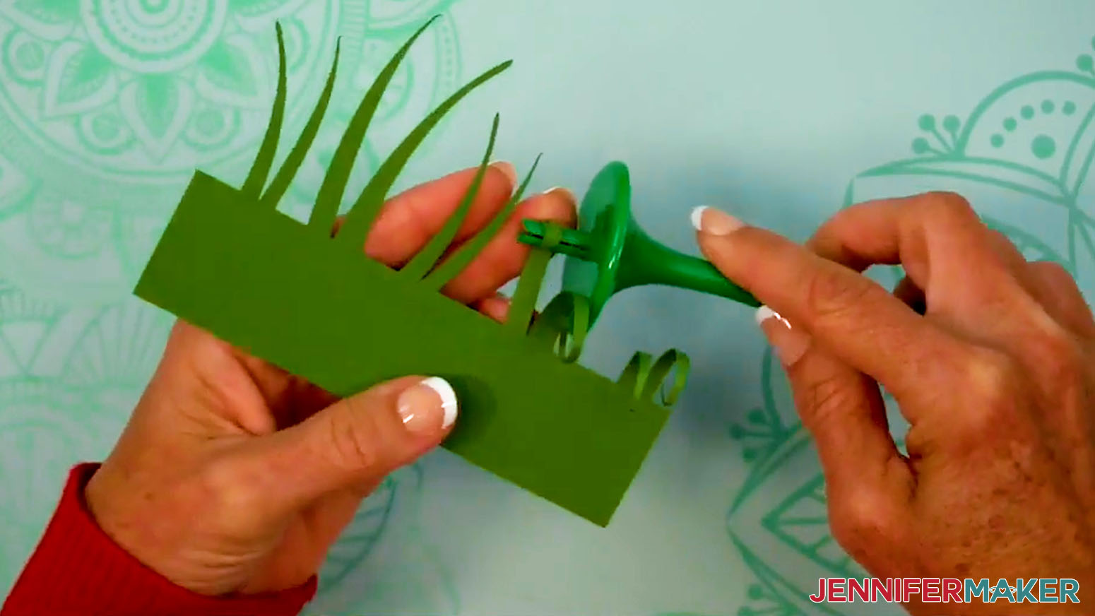 Curl the grass pieces down before forming the grass layer ring for the Fall Tea Light Holder.