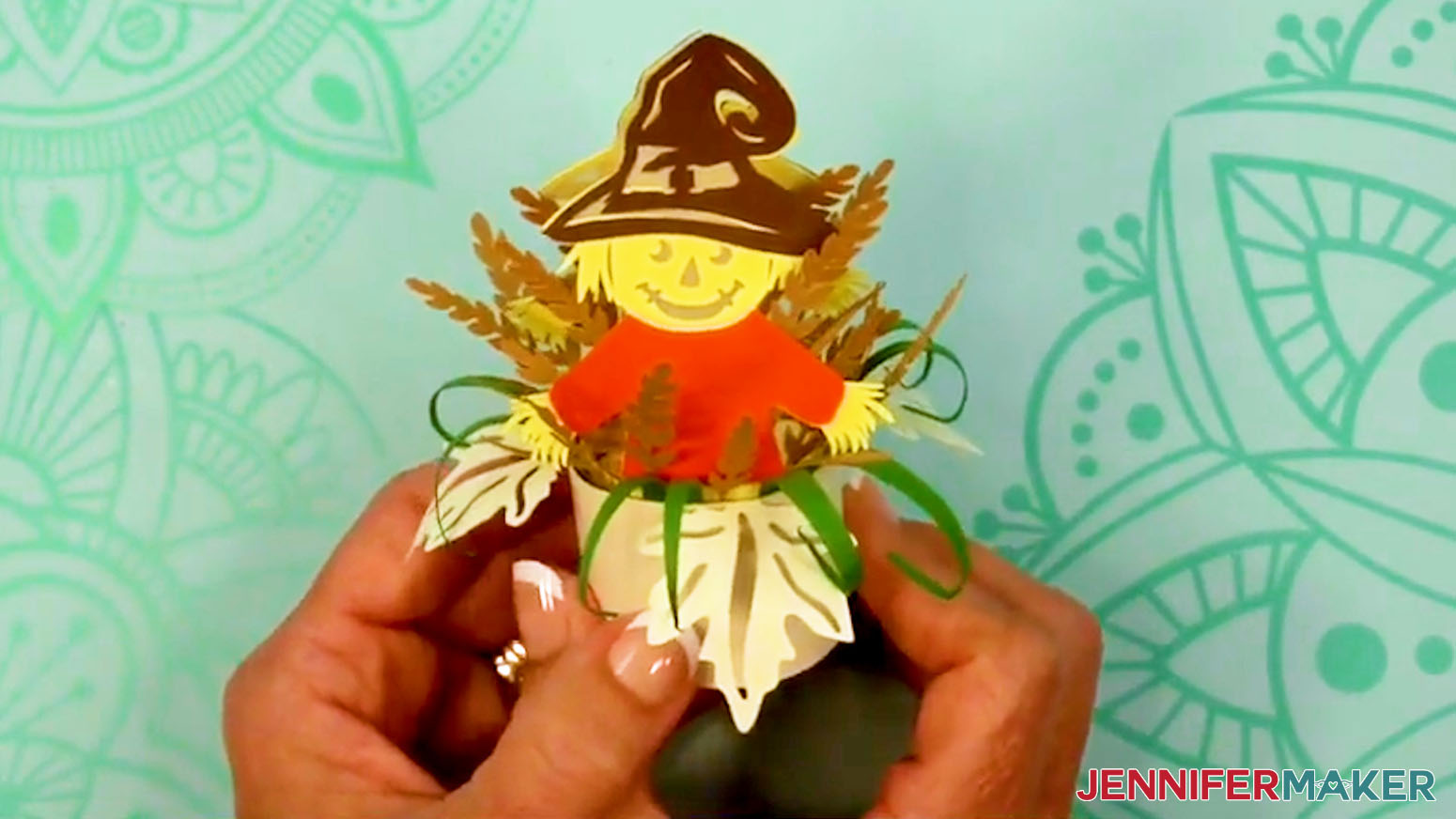 The Fall Tea Light Holder scarecrow design is finished and ready to use and display.