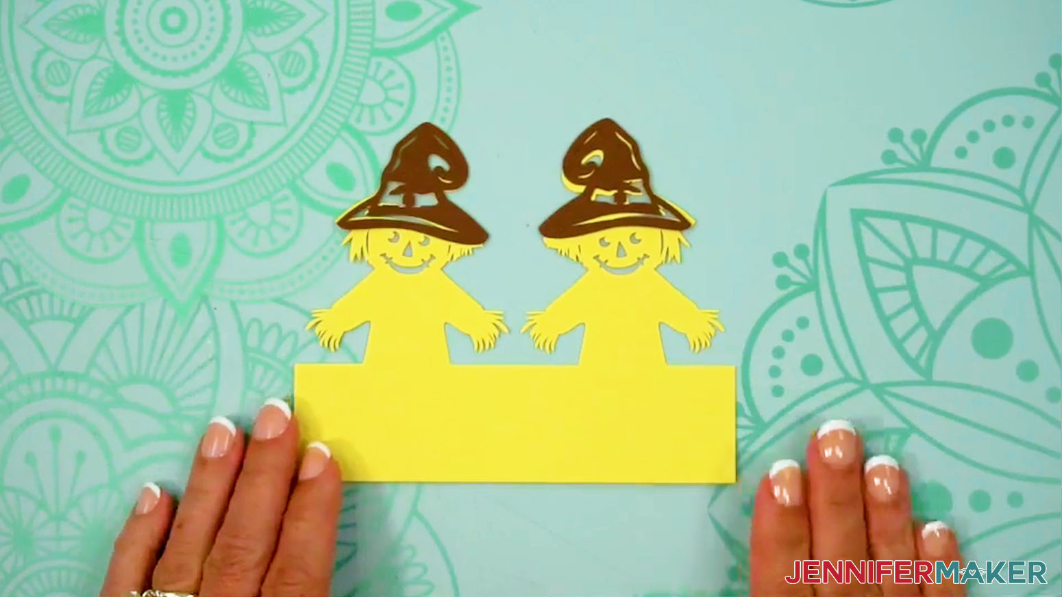 Glue the hats into place on the front of the Fall Tea Light Holder scarecrow layer.