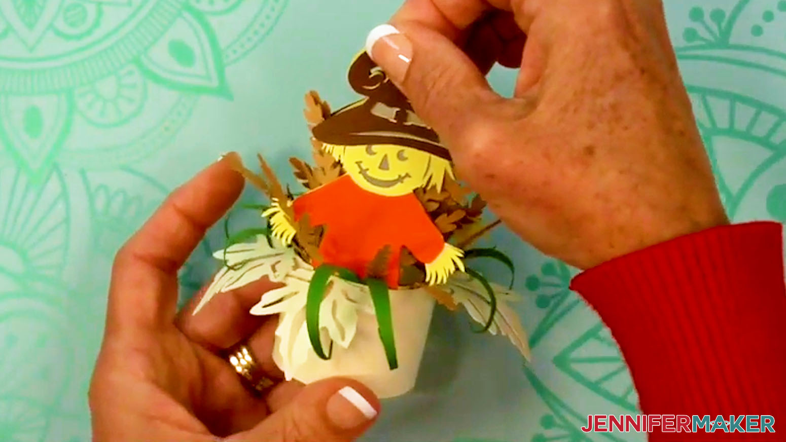 Close the top of the Fall Tea Light Holder by pressing the hook and loops dot pieces together.