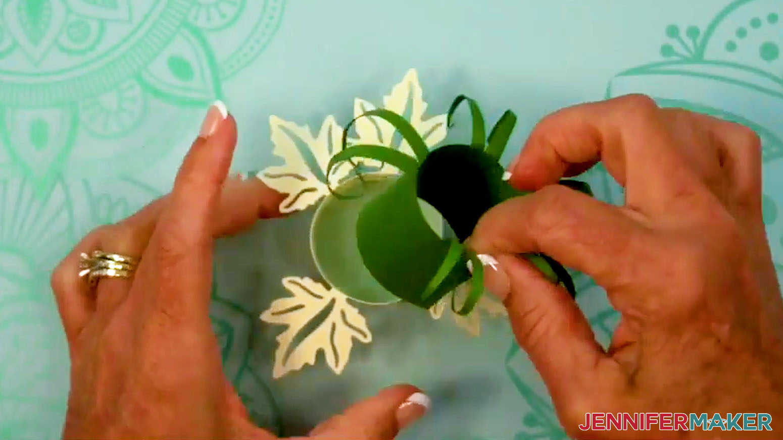 Insert the grass layer into the center of the Fall Tea Light Holder.