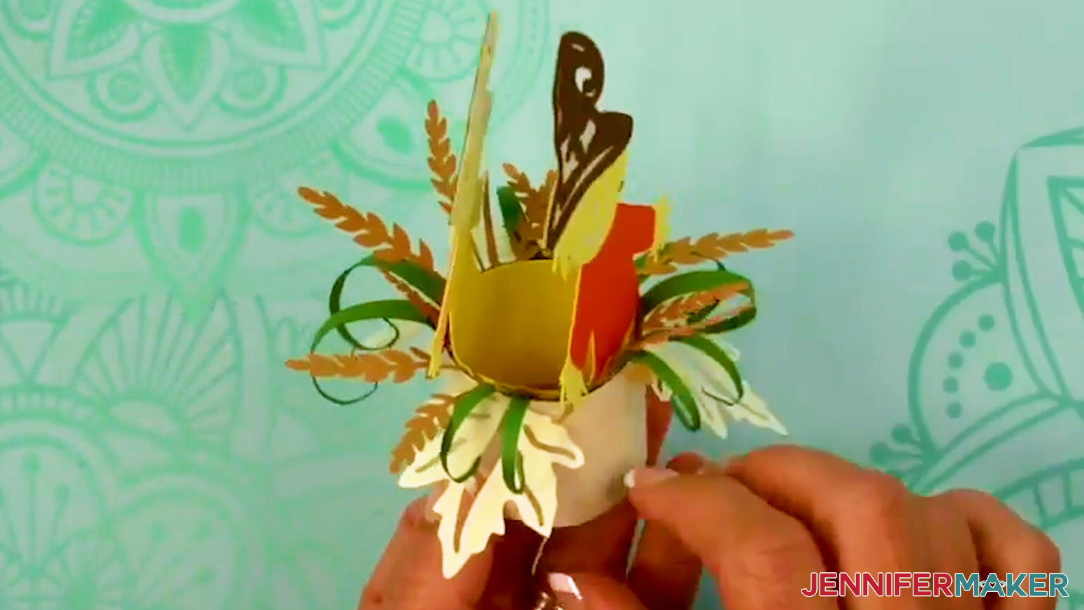 Insert the character layer into the Fall Tea Light Holder.