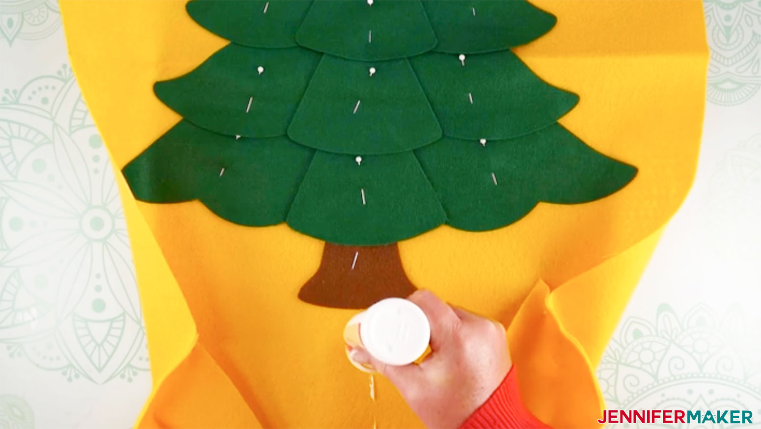 Add a line of glue to the center of the pocket for my Felt Christmas Tree Advent Calendar