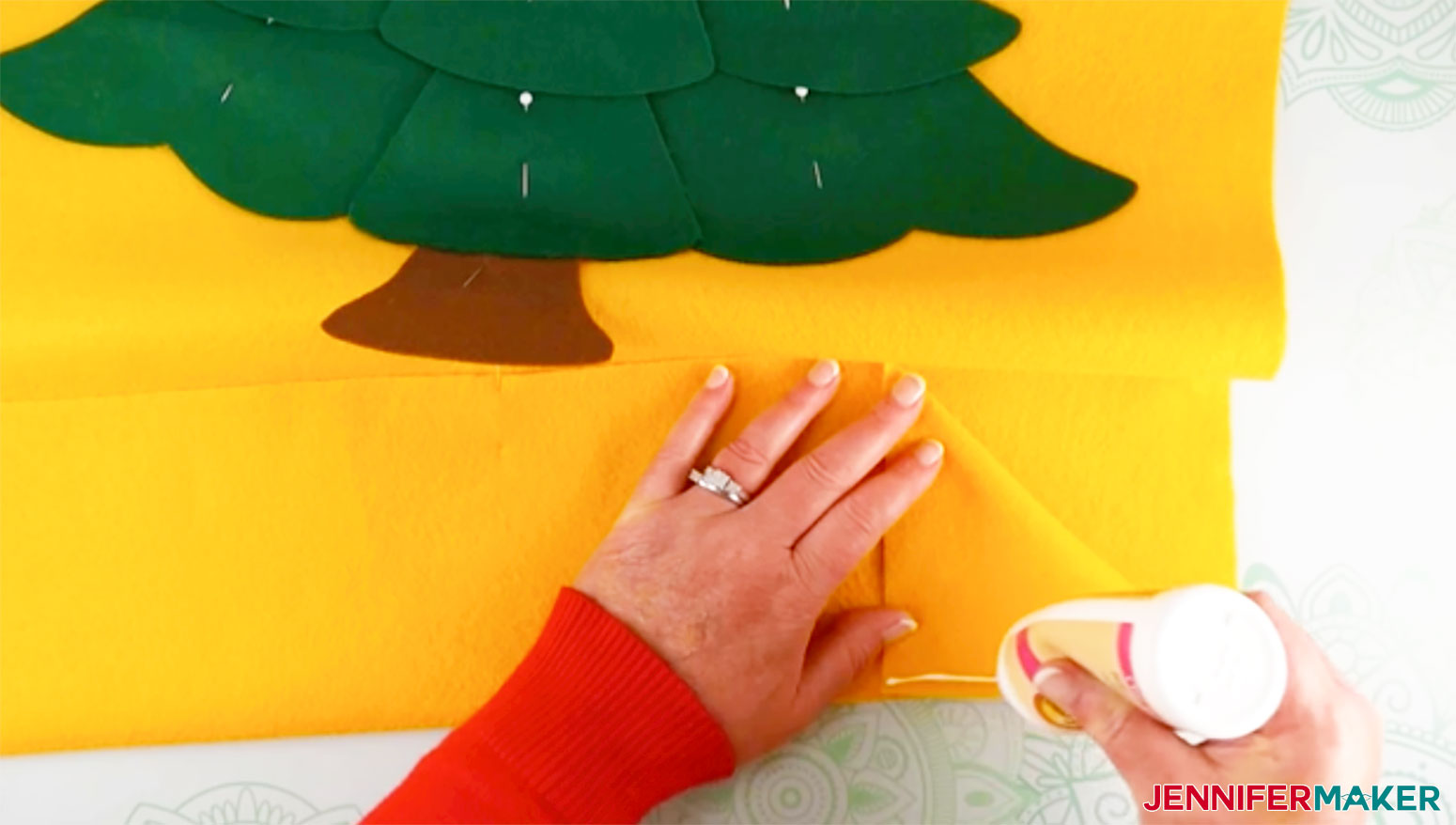 Add a line of glue to the right side of the pocket for my Felt Christmas Tree Advent Calendar