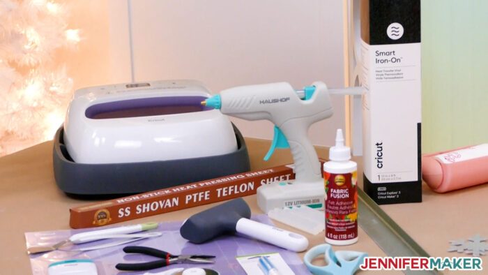 Cricut Easy Press, hot glue gun, Teflon sheet, brayer, wire cutters, glue, tools