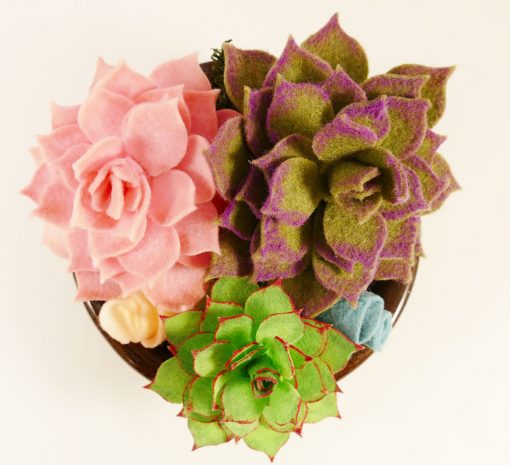 An arrangement of pretty felt succulents in a bowl