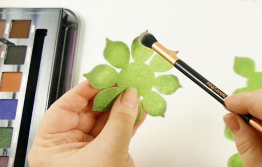 Coloring the felt succulent leaves with eye shadow