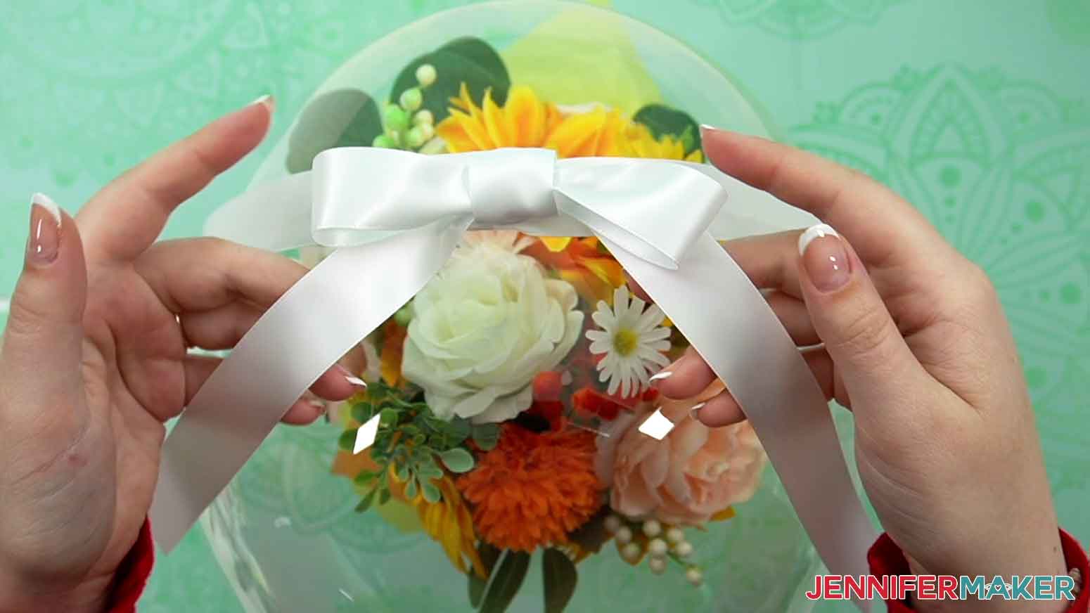 Make a simple bow and attach it to the top of the balloon with glue dots.