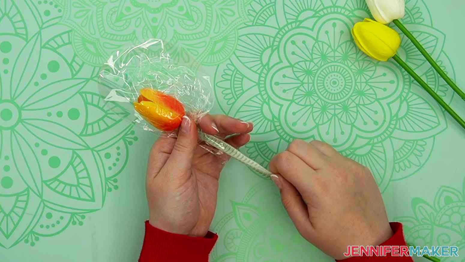 When the tulip is inside the balloon, the mesh wrap can be pulled down the stem and removed from the tulip.