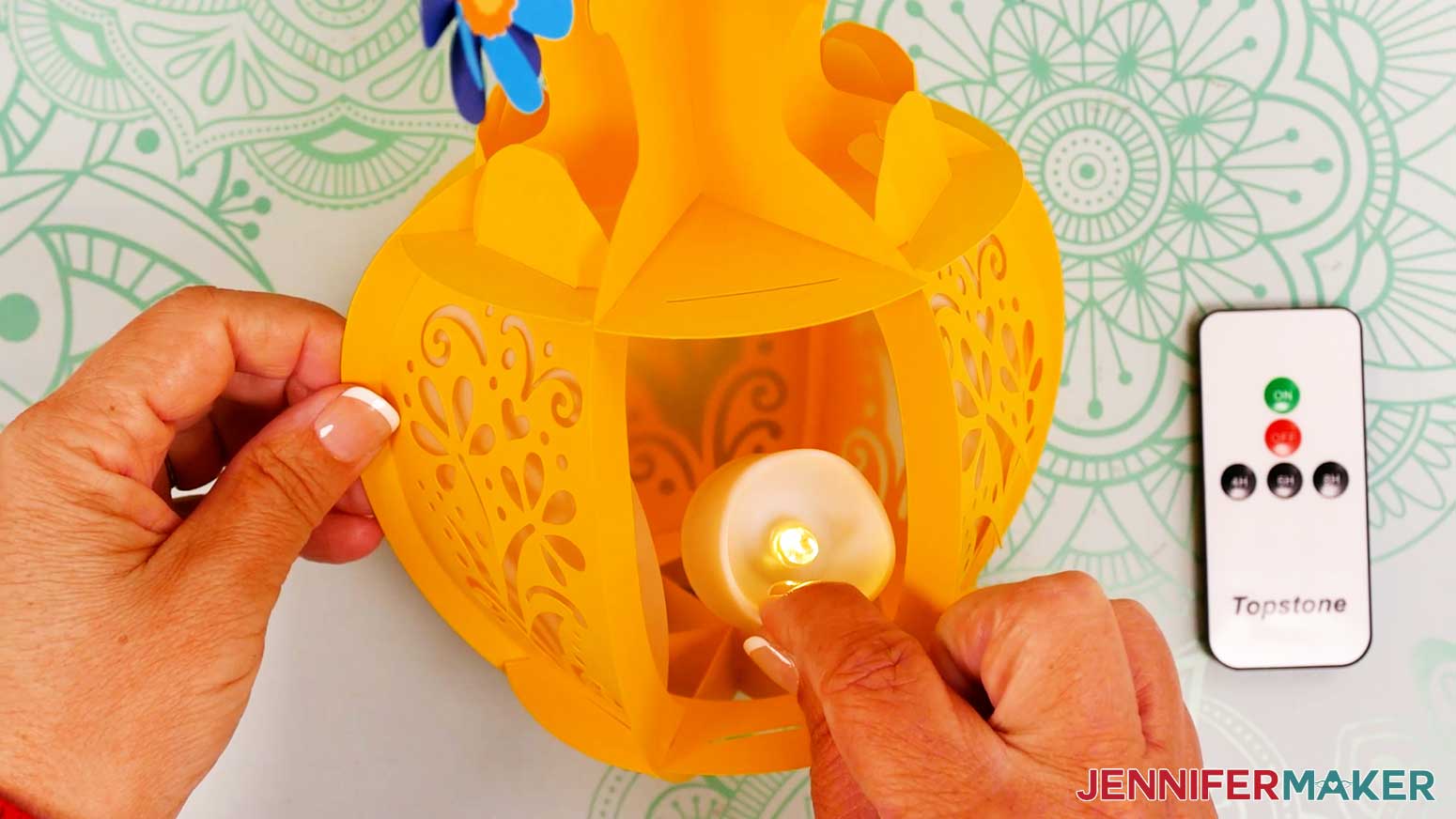 Place the LED tea light in the bottom of the vase on the flat section.