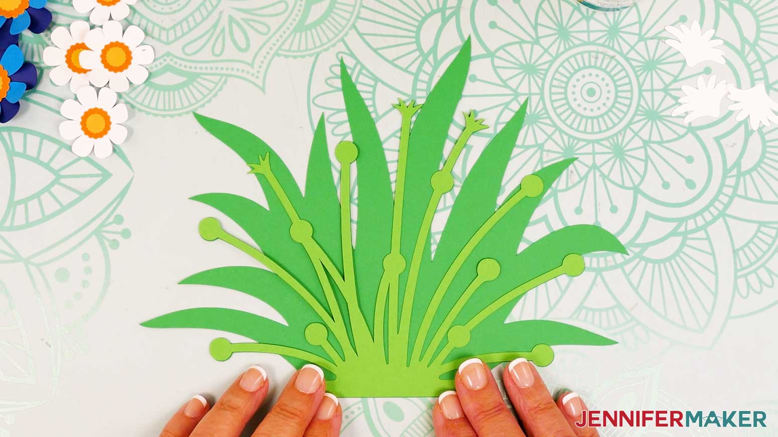 Align the front and back green foliage pieces for the flower bouquet lantern.