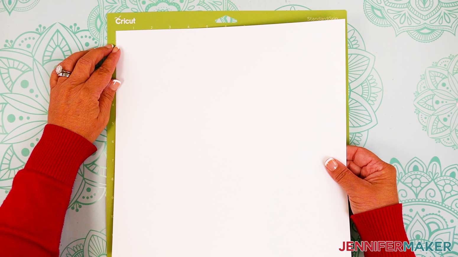 Place a sheet of cardstock on a green machine mat.