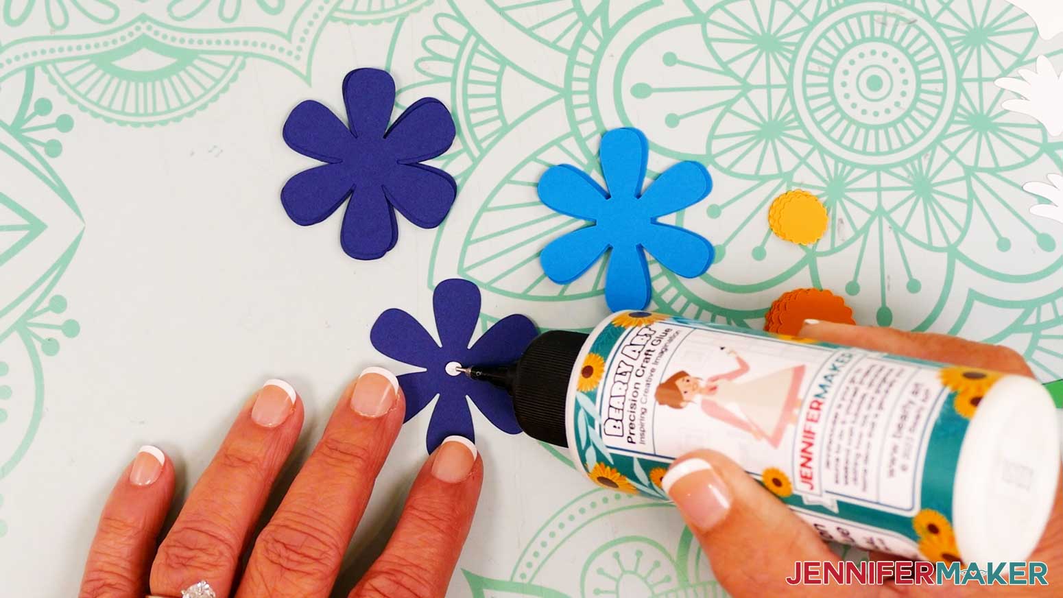 Add a small amount of craft glue in the center of a large back petal piece.