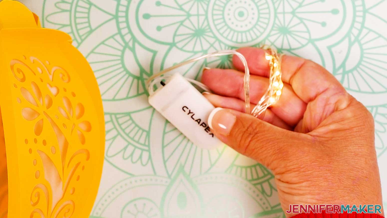 Loosely wrap the fairy lights wire around your fingers to make a coil to evenly distribute the lights.