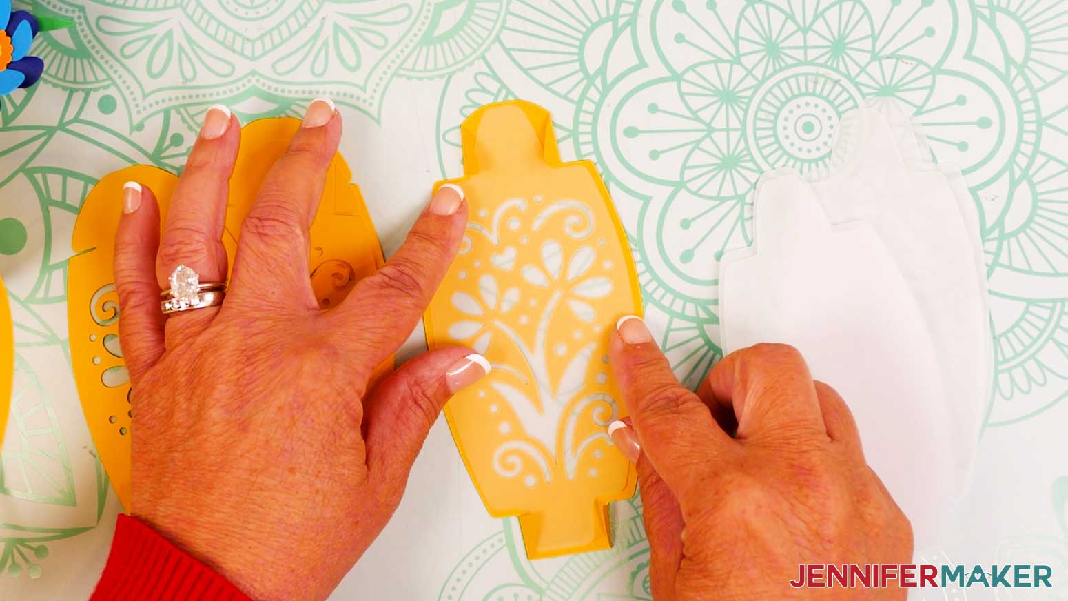 Insert a vellum diffuser piece onto the back of the folded flower bouquet lantern panel.