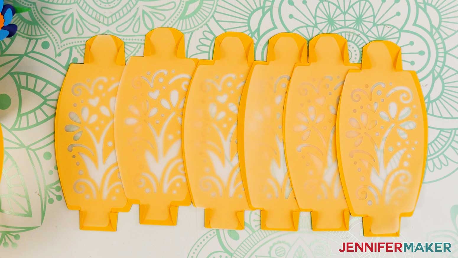 All six flower bouquet lantern panels and vellum diffusers folded and prepared.
