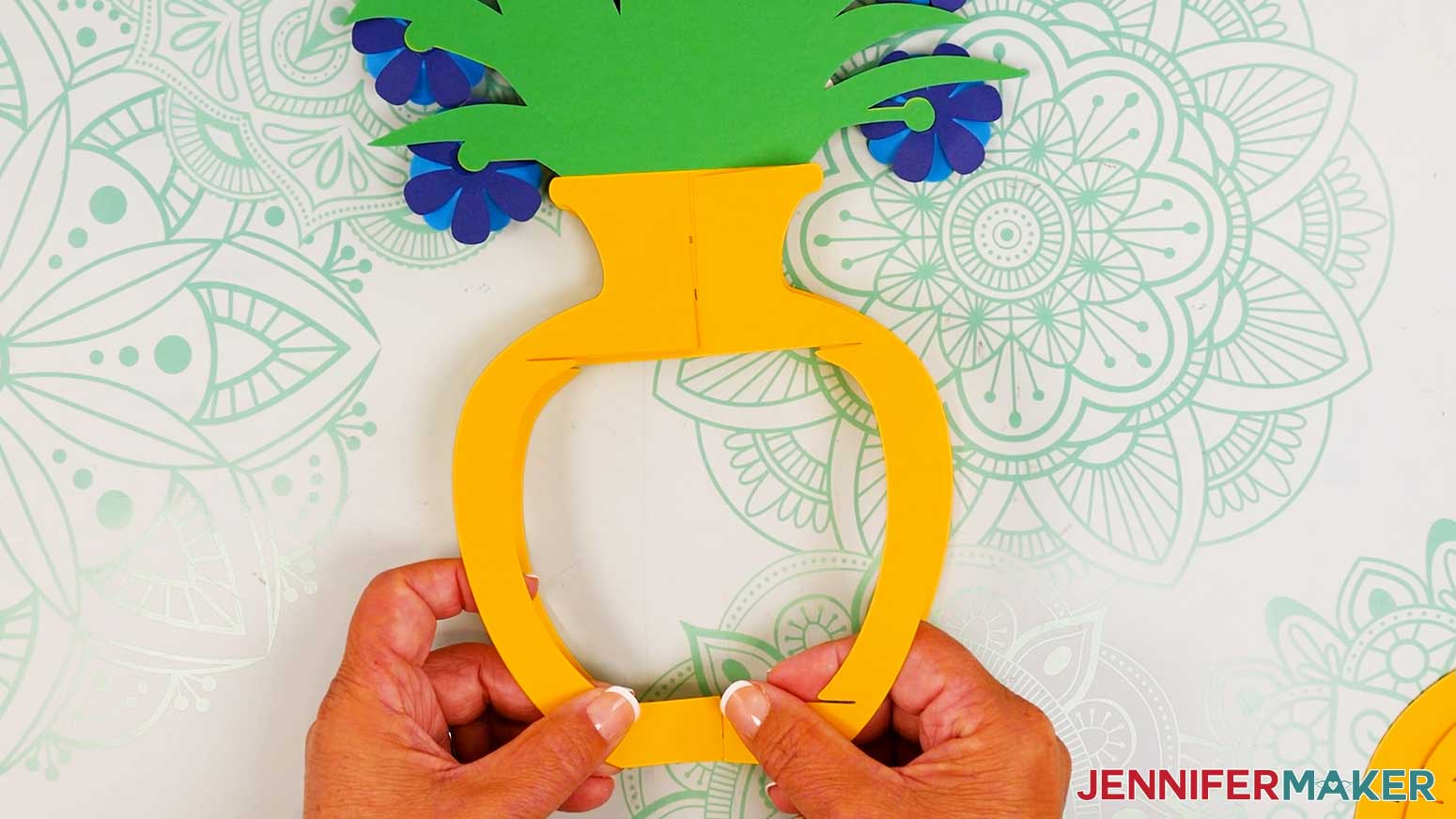 Fold the two frame pieces flat against each other, then slot in the final frame piece.