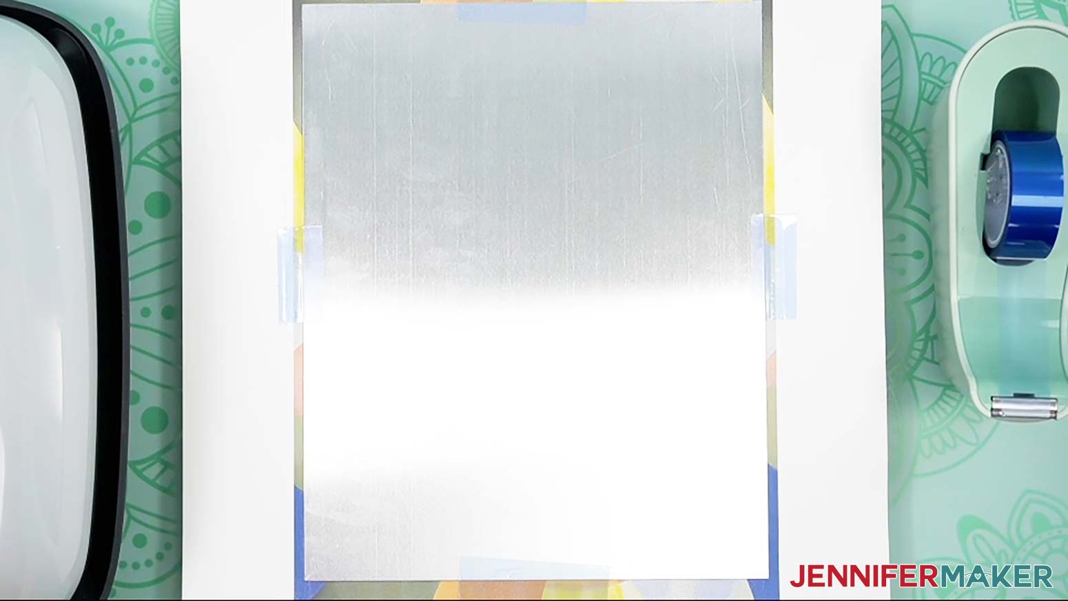 Use heat-resistant tape to secure the aluminum blank edges to the sublimation print.