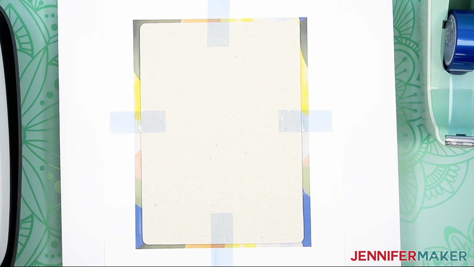 Heat-resistant tape to secures the puzzle's edges to the paper .