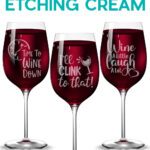 "Etch" glass without etching cream! Learn how with Jennifer Maker's new tutorial. Three wine glasses filled with red wine, showing cute wine-related faux etched vinyl decals.