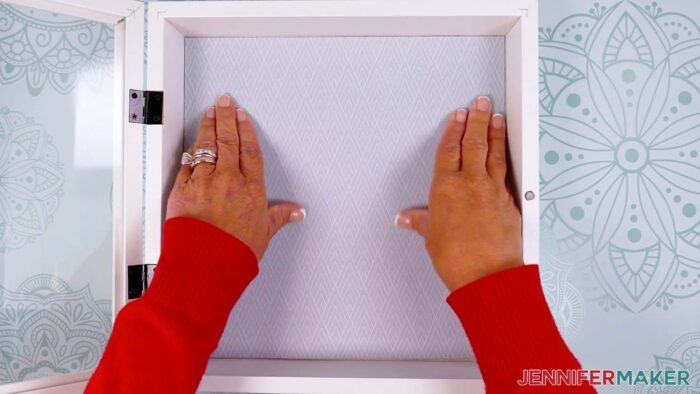 Press the cardstock in place inside the shadow box.