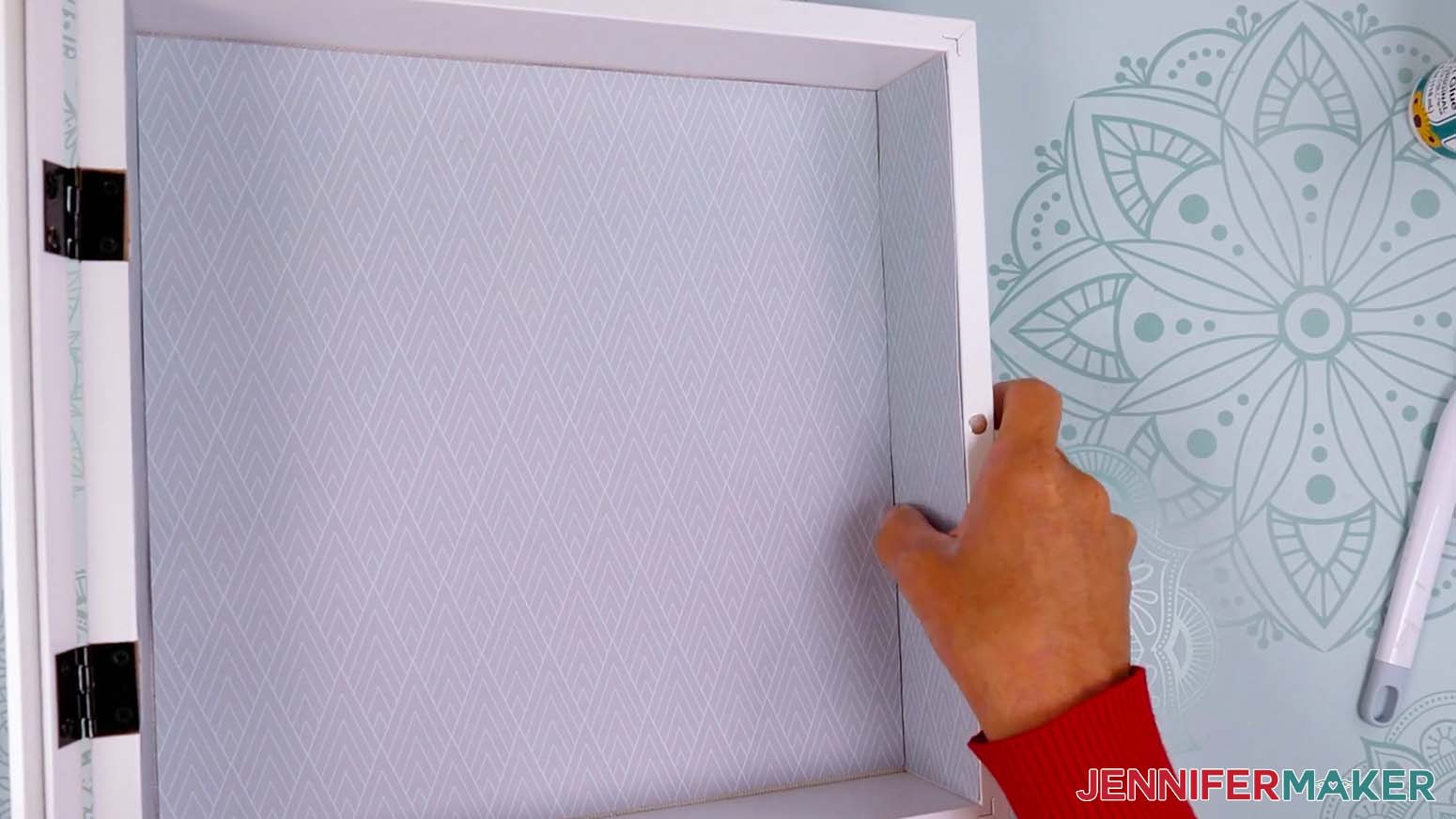 Apply glue and adhere the side wall pieces to the inside of the shadow box.
