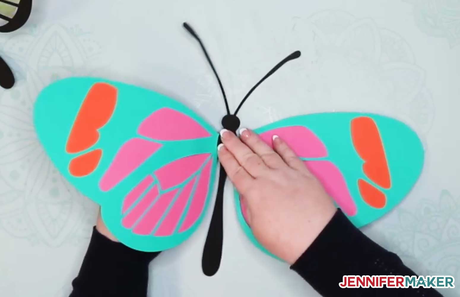 Folding up the wings on the giant paper butterfly