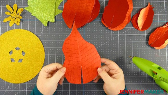 Cut paper pieces for the giant paper poinsettia flower