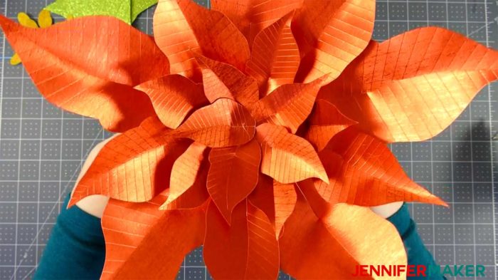 Arranging the leaves on the giant paper poinsettia flower