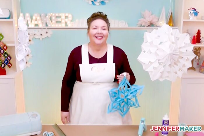 Giant Paper Snowflakes in blue and white with Jennifer Maker in her craft room