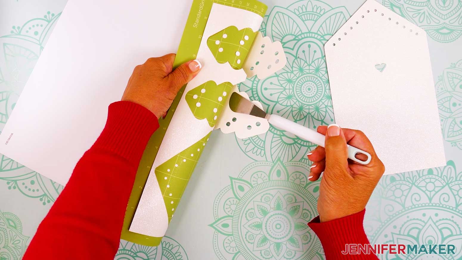 Use a Cricut spatula to lift the delicate gingerbread card pieces off the machine mat.