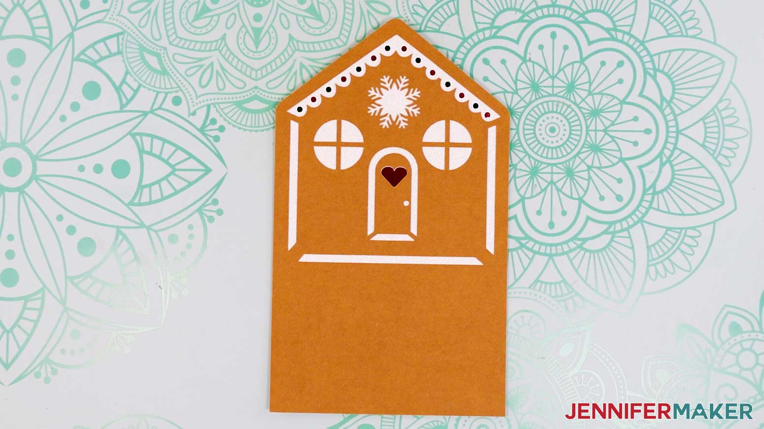 Adhere layer four to the back of the gingerbread house card's house tier.
