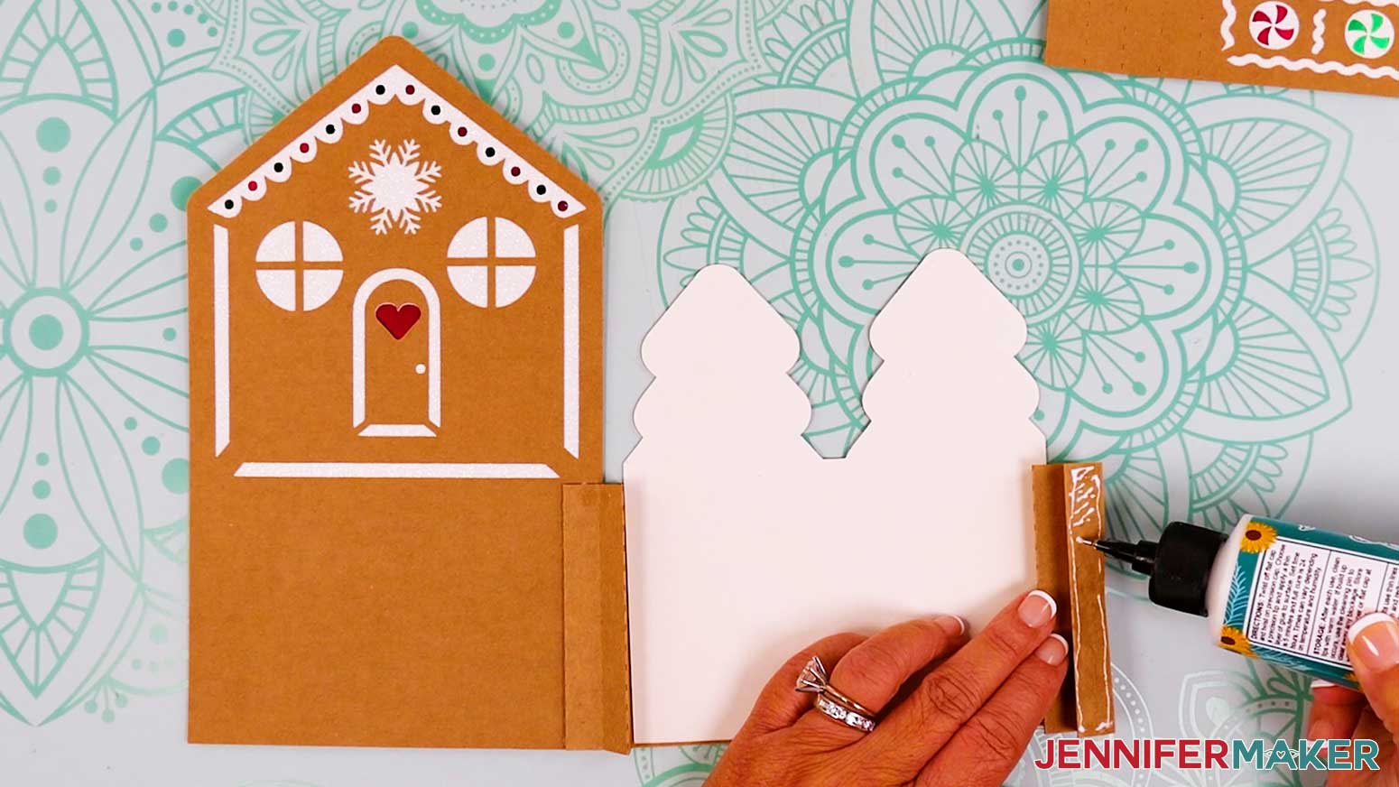 Adding glue to the accordion fold on the right side of the tree tier with the tier face down.