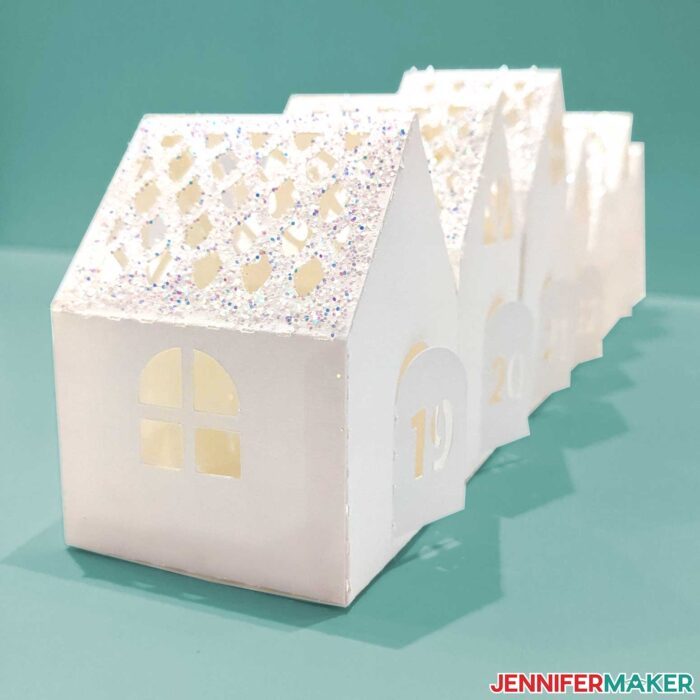Glittery white gingerbread village countdown houses.