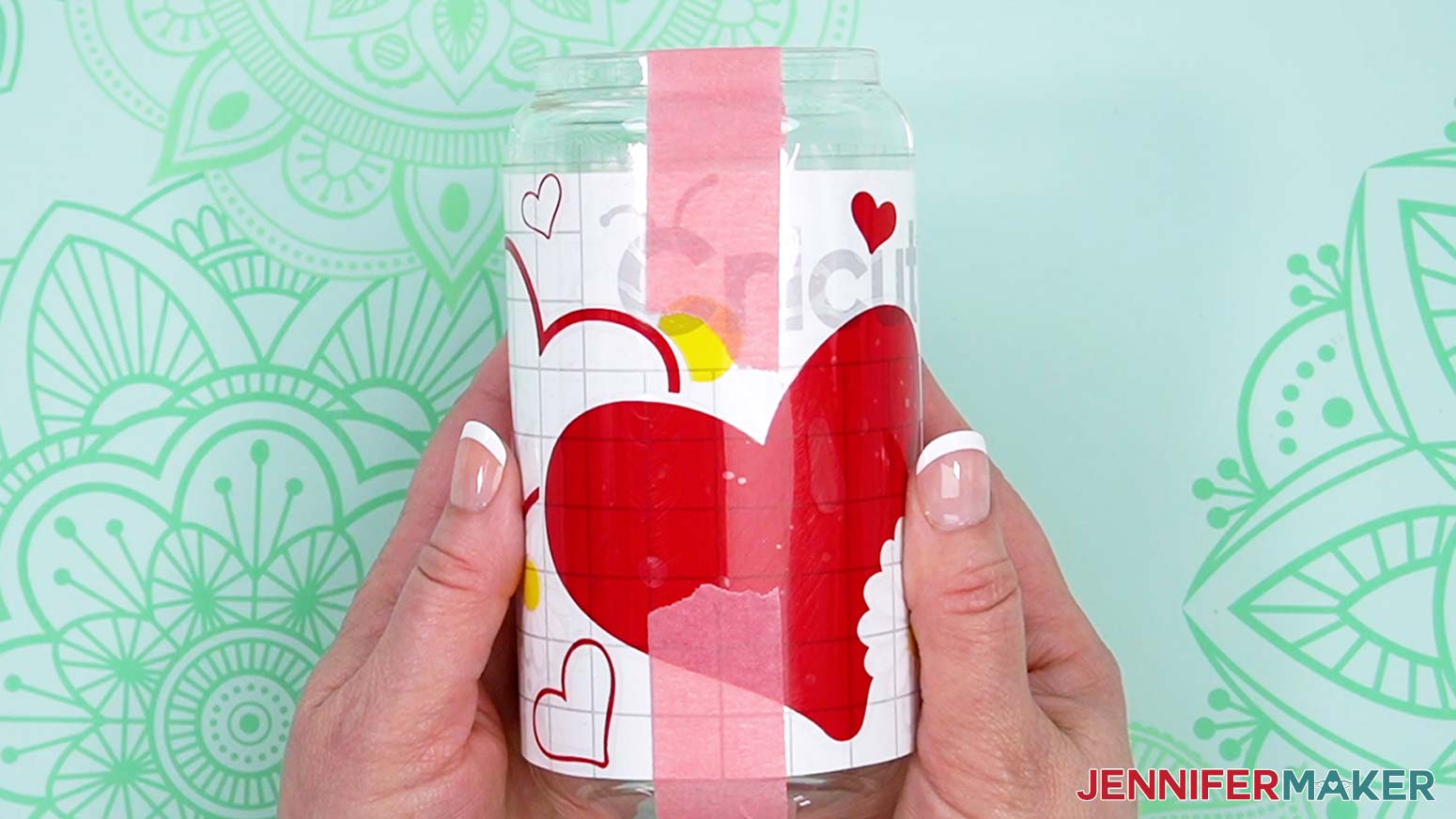 Tape the design to the glass jar using painters tape on the top and bottom of the design in the middle of the layer.
