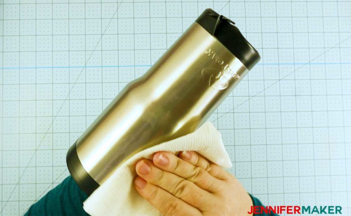 Clean the surface of your stainless steel tumbler with rubbing alcohol in step 1 of the glitter tumbler tutorial