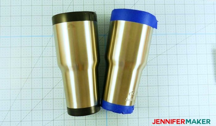 Two tumblers taped at the top and bottom in preparation to become a glitter tumbler