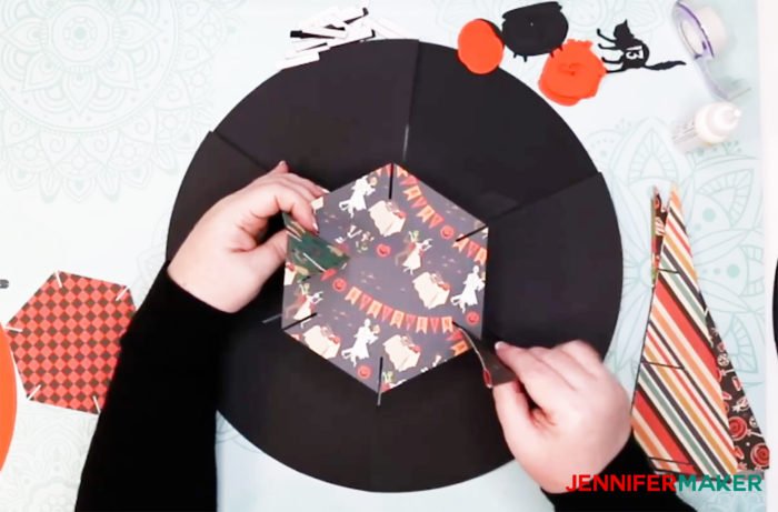 Sliding the supports into the hat brim of the DIY Halloween Countdown Calendar