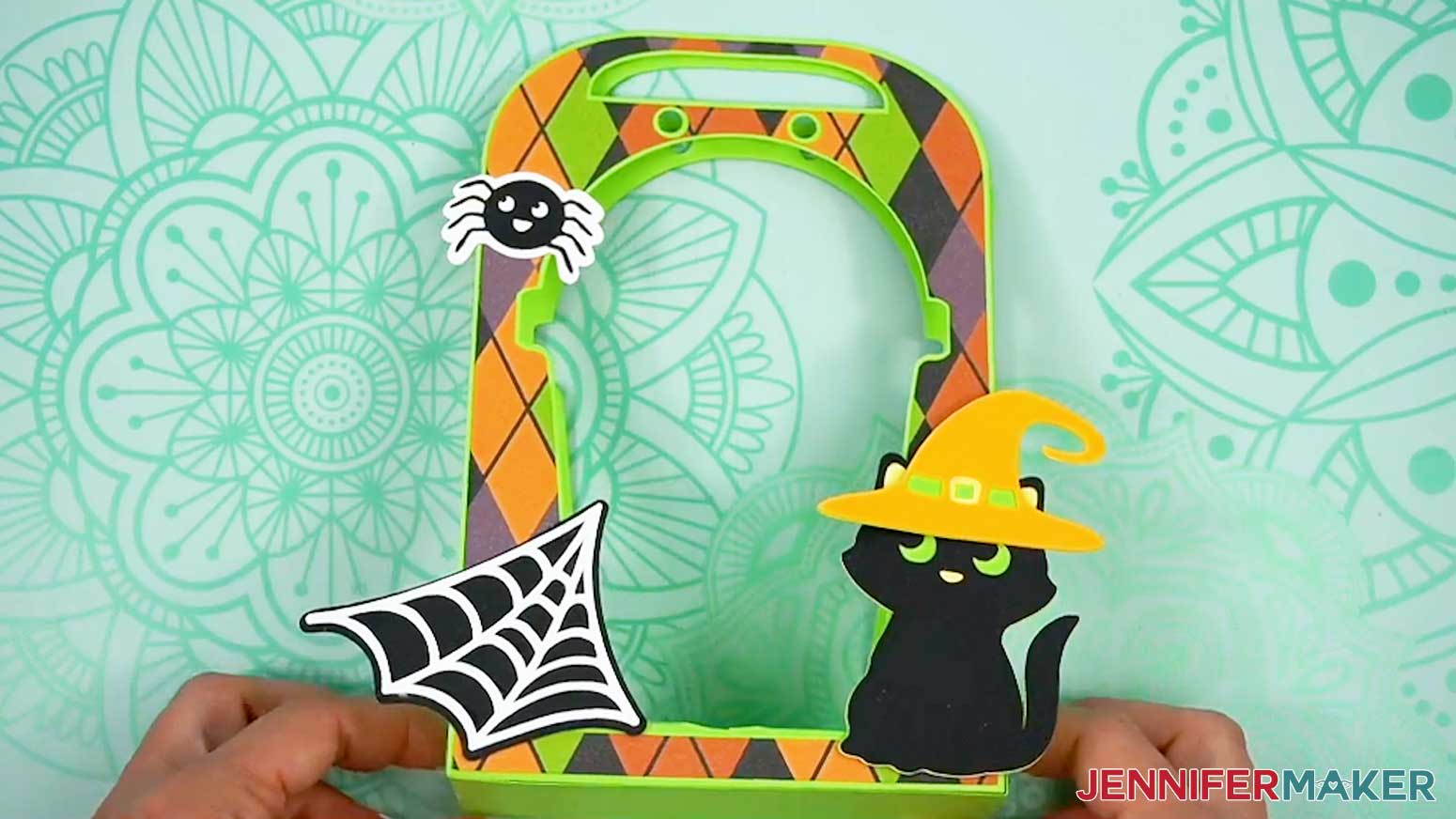 The base of the Halloween treat cup holder now has the embellishments attached.