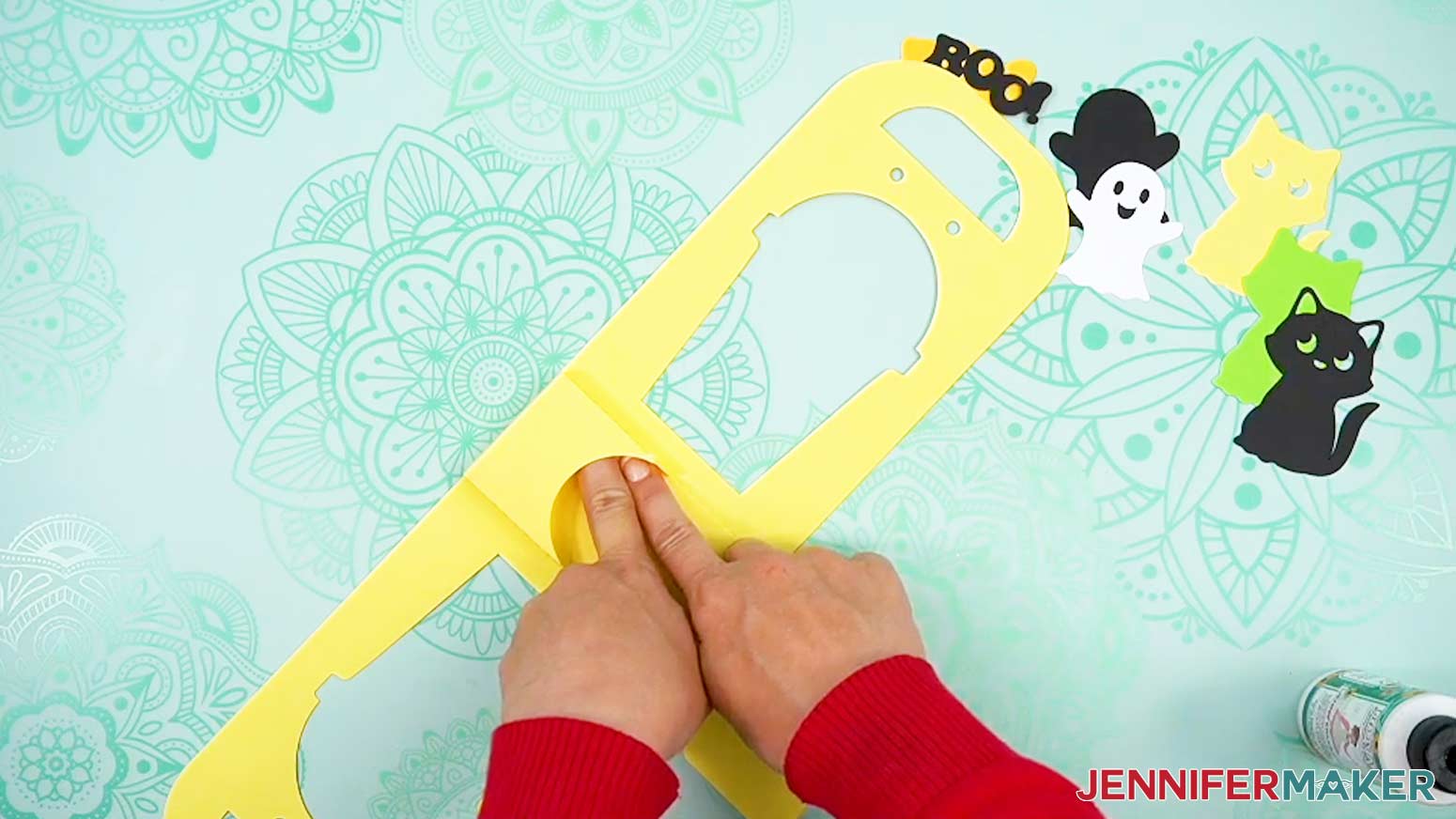 Fold and glue the pocket pieces into the Joy Xtra Halloween treat cup holder base assembly to make the inside cup pocket area.