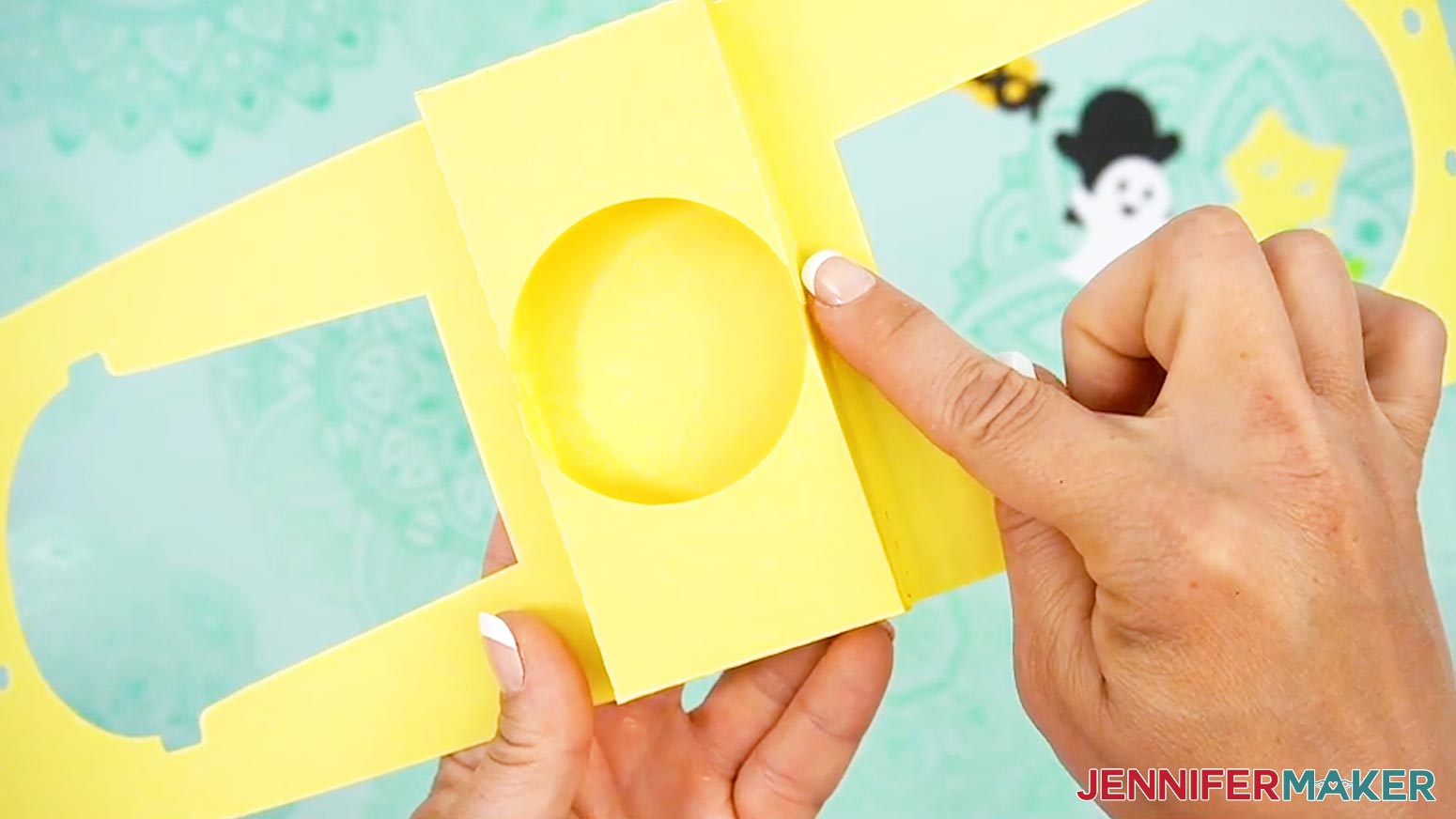 Place the end pieces of the Halloween treat cup holder cup pocket sides together so that they are as close as possible, but do not overlap in the middle.