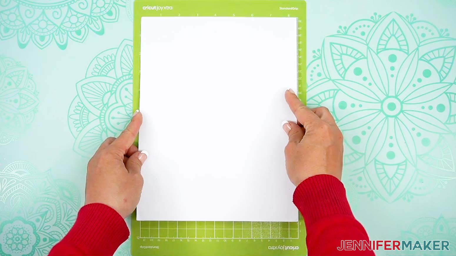 Place a piece of cardstock for the Halloween treat cup holder onto the Joy Xtra machine mat.